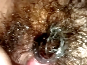 A solo boy with an Asian look enjoys licking his body.