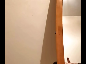 A chubby gay man masturbates in front of a hidden camera.