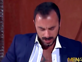 Xavi Duran, a handsome businessman, has anal sex with a blond gay at work.