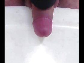 Gay Japanese man masturbates with a massage gun.