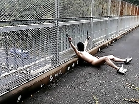 Takehito goes naked on a pedestrian bridge in the middle of the day