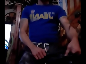 Gay pornstar Norik enjoys some ballbusting in a scene.