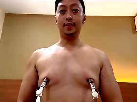 Gay stud gets nipple pumps in feature show