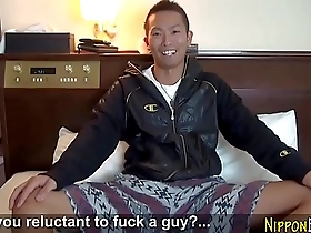 A young Japanese man masturbates and ejaculates.