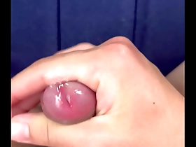 Young Japanese man masturbates slowly.