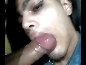 Gay guy gives blow job in a party atmosphere