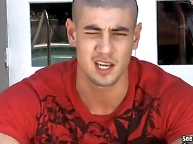 Young gay hunk enjoys outdoor massage and handjob from another guy