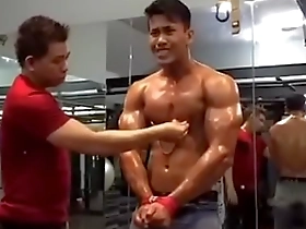 Gay Asian gym top’s nipple tease