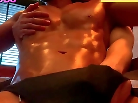 Muscular Asian man enjoys nipple play.