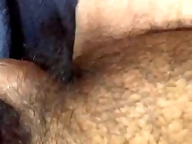 Gay Asian sissy gets off while using a black dildo to stimulate his small penis.