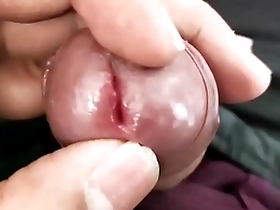 A young Asian boy shows off his small penis.