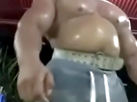 A thick and muscular Thai man shows off his physique in the gym.