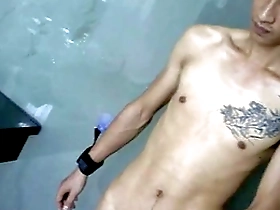 Young Asian boy with a big cock pleases himself while in bondage.