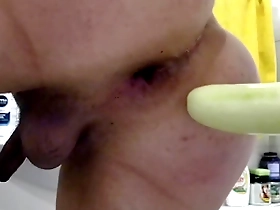 Big ass shemale takes a cucumber up her ass