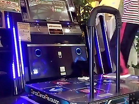Gay Japanese man enjoys DDR with a hard cock